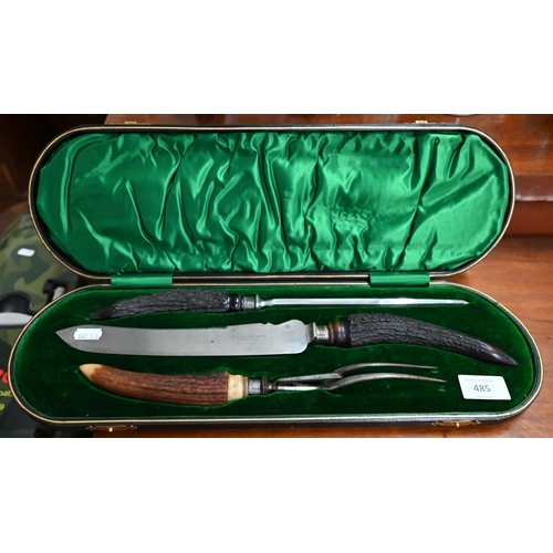 485 - An Edwardian cased three-piece carving set with silver-mounted antler handles, Sheffield 1905