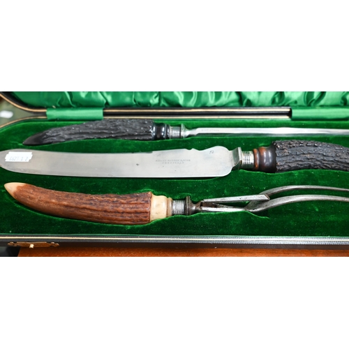 485 - An Edwardian cased three-piece carving set with silver-mounted antler handles, Sheffield 1905