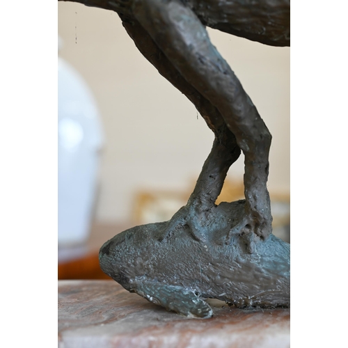 487 - Margot Wilde - A composite group of an eagle catching a fish, on marble plinth 46 cm high