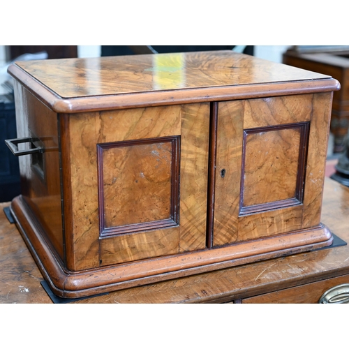 488 - A Victorian walnut canteen with flush brass side handles, twin panel doors enclosing four drawers, c... 