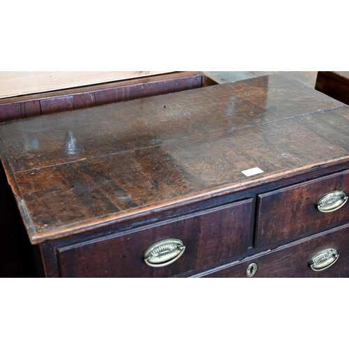 5 - An 18th century and later oak chest of two short over three long graduating drawers raised on shaped... 