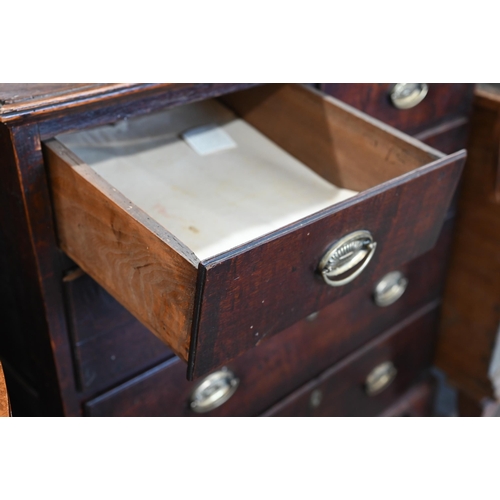 5 - An 18th century and later oak chest of two short over three long graduating drawers raised on shaped... 