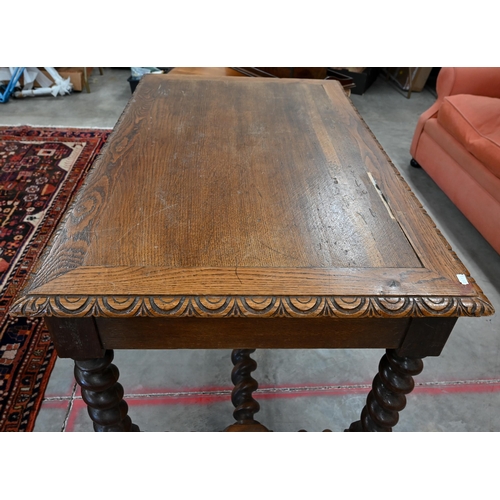 50 - A carved oak centre table with two frieze drawers on barley twist supports and stretchers, 118 cm w ... 