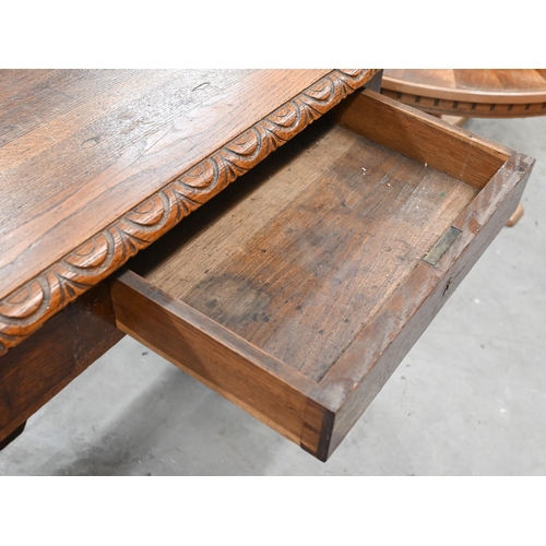 50 - A carved oak centre table with two frieze drawers on barley twist supports and stretchers, 118 cm w ... 