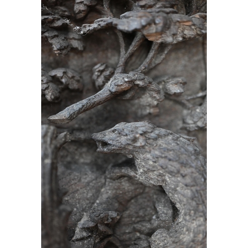 500 - A pair of antique bas-relief carved panels, depicting 'Nature red in Tooth and Claw', with various a... 