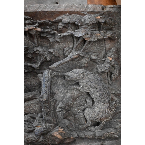 500 - A pair of antique bas-relief carved panels, depicting 'Nature red in Tooth and Claw', with various a... 