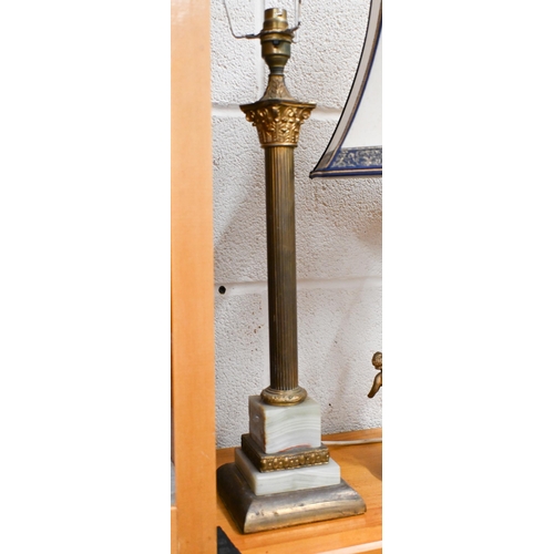 504 - Two brass and onyx table lamps to/w an Art Deco style plaster wall mask and a cow bell (4)