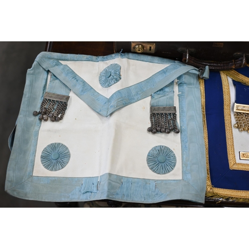 505 - Two Masonic aprons and sash with regalia, to/w various books etc in leather 'Pakawa' case