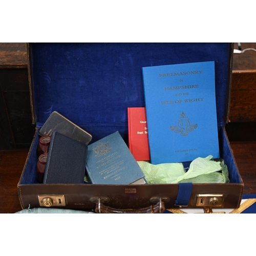 505 - Two Masonic aprons and sash with regalia, to/w various books etc in leather 'Pakawa' case