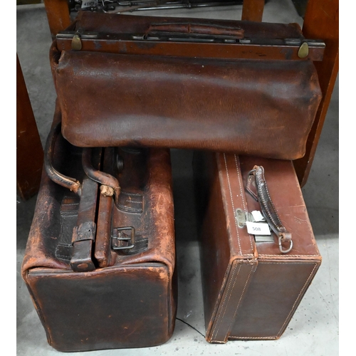 508 - Two antique leather Gladstone bags and a small suitcase (3)