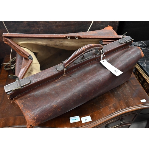 512 - # An antique leather Gladstone bag and two vintage leather suitcases (3 - a/f)