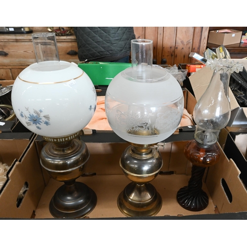 514 - # Three various oil lamps with chimneys (two with glass shades)