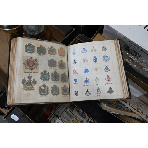 516 - A Victorian album of crests to/w various cigarette and trade cards and other printed ephemera etc (b... 