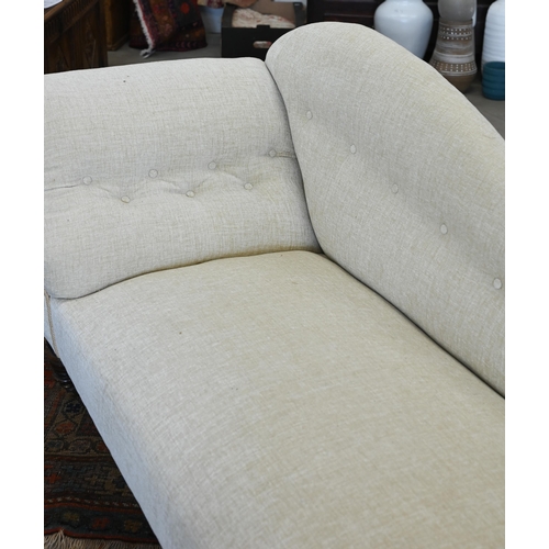 52 - A late Victorian scroll-end chaise longue with shaped back, buttoned cream chenille upholstery and t... 