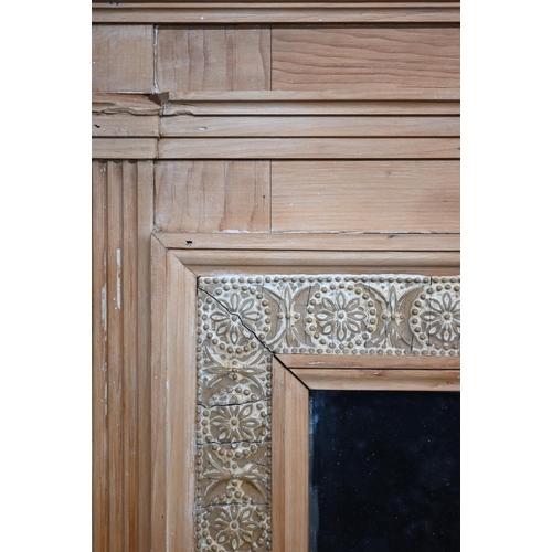 55 - An antique over mantel mirror in moulded pine and floral gesso frame, 126 cm x 130 cm h