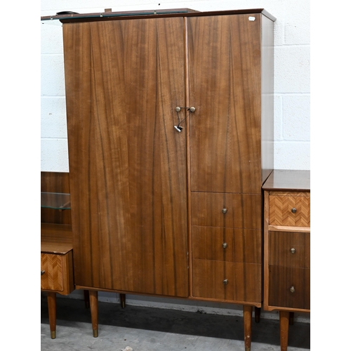 57 - A mid-century Uniflex bedroom suite comprising a small compactum, 88 cm x 46 cm x 148 cm h, dressing... 