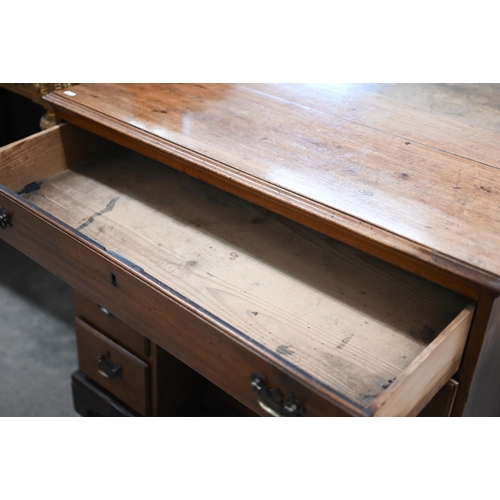 59 - A 19th century mahogany kneehole desk with arrangements of eight drawers around the recessed central... 