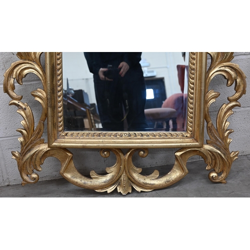 61 - A Florentine style wall mirror with scrolling acanthus giltwood frame, 92 cm x 145 cm h