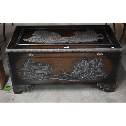 65 - A Chinese carved hardwood and camphor lined trunk, 96 cm w x 48 cm d x 48 cm h