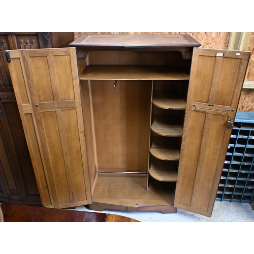 66 - Two 'L. Marcus Ltd' oak wardrobes with linenfold carved panels, 130 x 55 x 185 cm h (largest) (2)