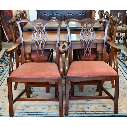 73 - A set of eight Chippendale style mahogany dining chairs with terracotta fabric pad seats, two carver... 