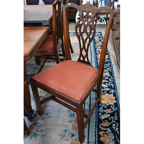 73 - A set of eight Chippendale style mahogany dining chairs with terracotta fabric pad seats, two carver... 