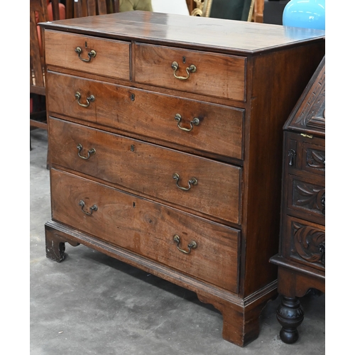 76 - A George III mahogany chest of two short over three long graduating drawers raised on bracket feet,1... 