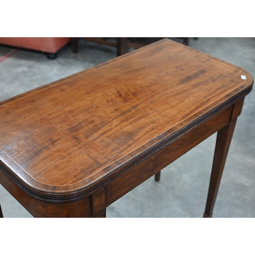 77 - A 19th century mahogany crossbanded folding tea table on tapering square supports, 88 cm w x 45 cm d... 