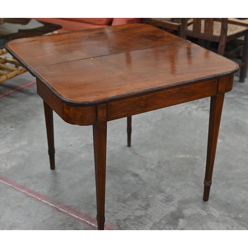 77 - A 19th century mahogany crossbanded folding tea table on tapering square supports, 88 cm w x 45 cm d... 