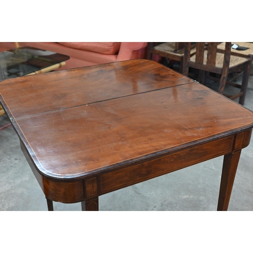 77 - A 19th century mahogany crossbanded folding tea table on tapering square supports, 88 cm w x 45 cm d... 