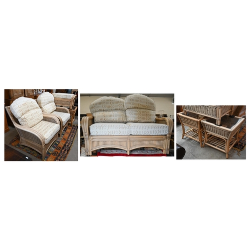 79 - A cane and wicker-rattan conservatory suite comprising a two-seater sofa, 150 cm x 80 cm x 100 cm h,... 