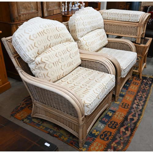 79 - A cane and wicker-rattan conservatory suite comprising a two-seater sofa, 150 cm x 80 cm x 100 cm h,... 