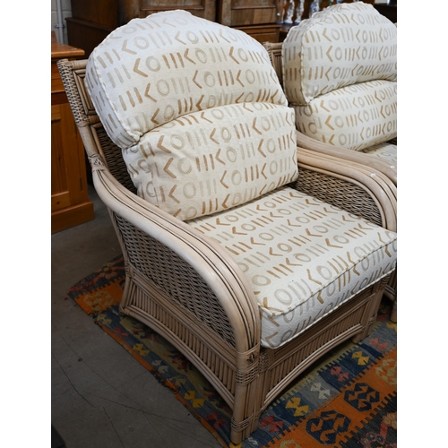 79 - A cane and wicker-rattan conservatory suite comprising a two-seater sofa, 150 cm x 80 cm x 100 cm h,... 