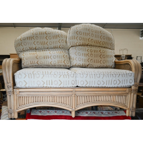 79 - A cane and wicker-rattan conservatory suite comprising a two-seater sofa, 150 cm x 80 cm x 100 cm h,... 