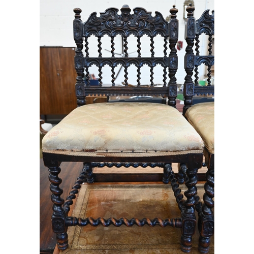 83 - A pair of 19th century carved oak hall chairs with barley twist spindles, supports and stretchers, g... 