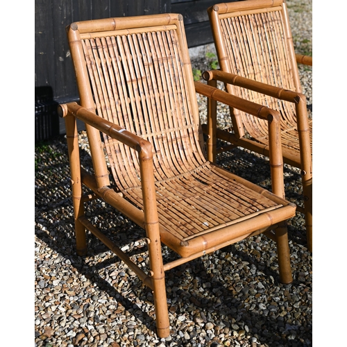 88 - A pair of vintage bamboo elbow chairs and coffee table with smoked glass top, 116 x 58 x 46 cm high