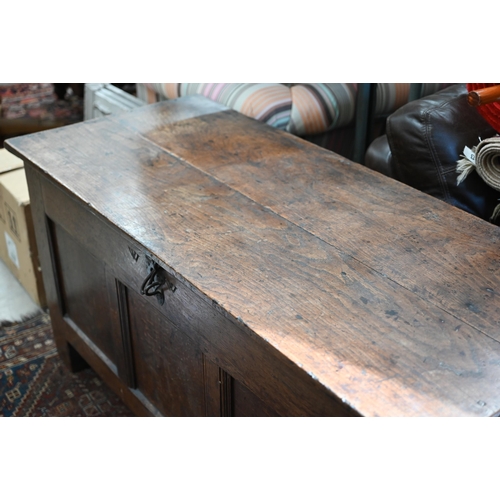 90 - A large antique oak and elm coffer of traditional panelled construction with hinge top, 134 x 60 x 6... 