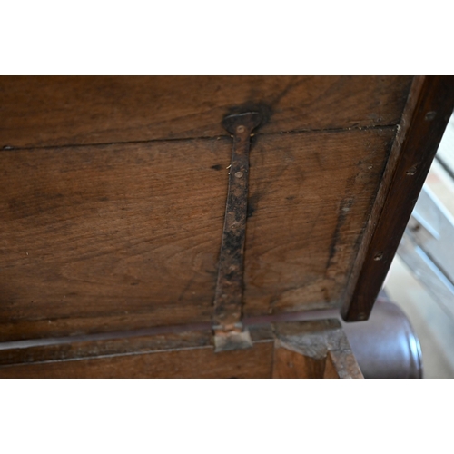 90 - A large antique oak and elm coffer of traditional panelled construction with hinge top, 134 x 60 x 6... 