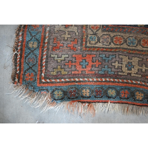 93 - Antique Kurdish runner of geometric design on red ground with repeating borders, very worn, 290 x 12... 