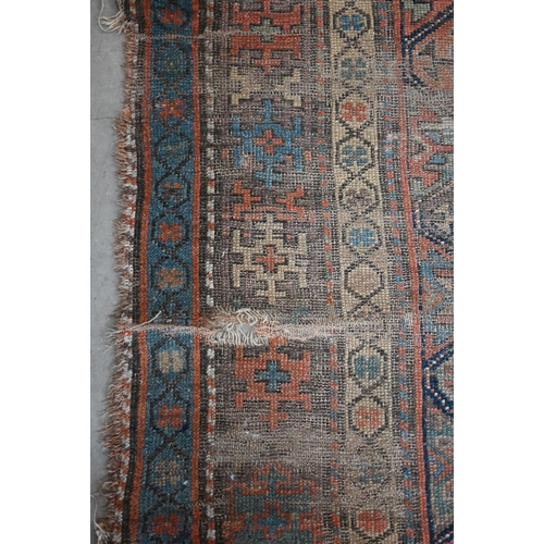 93 - Antique Kurdish runner of geometric design on red ground with repeating borders, very worn, 290 x 12... 