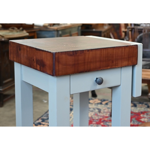 99 - A stained hardwood butcher's block on painted base with knife rack, drawer and slatted under tier, 5... 