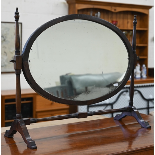 102 - A Victorian mahogany serpentine front dressing table with nine drawers to/w an oval mahogany framed ... 