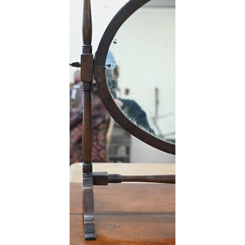 102 - A Victorian mahogany serpentine front dressing table with nine drawers to/w an oval mahogany framed ... 