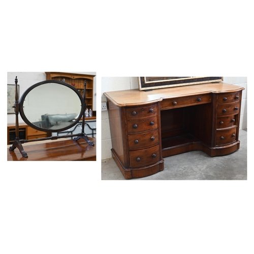 102 - A Victorian mahogany serpentine front dressing table with nine drawers to/w an oval mahogany framed ... 