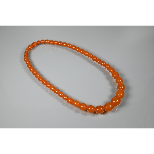 234 - Two rows of graduated amber beads, each with concealed screw clasp, approx 100g (2)