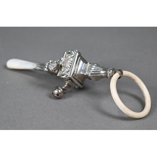101 - A silver baby rattle in the Regency manner, with composite teething ring, square baluster body hang ... 