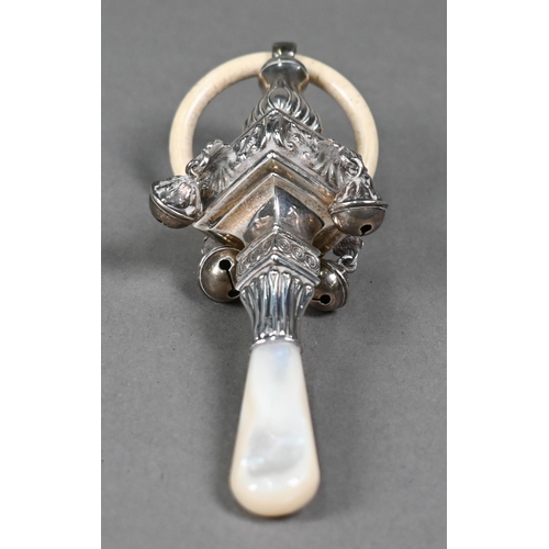 101 - A silver baby rattle in the Regency manner, with composite teething ring, square baluster body hang ... 