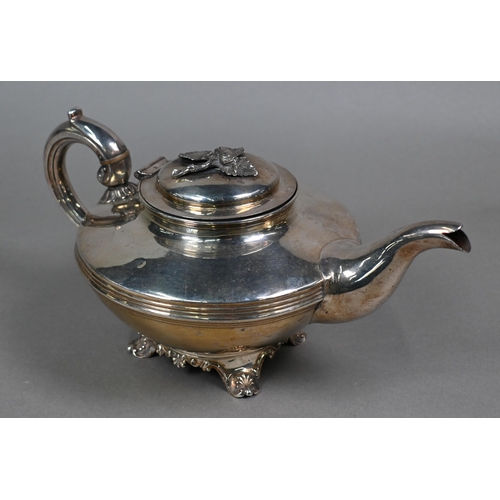 106 - A William IV silver three piece tea service of compressed circular form with scroll handles and reed... 