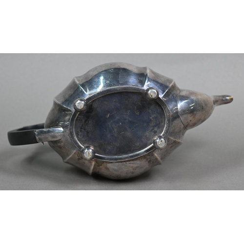 113 - An oval silver teapot with composite handle and finial, on ball feet, Henry Williamson Ltd., Birming... 