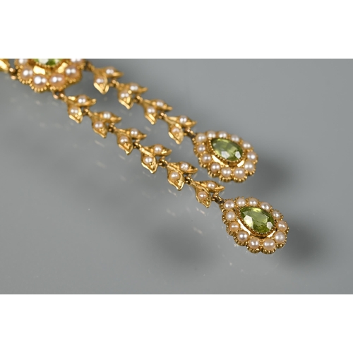 169 - An Edwardian 15ct yellow gold necklace set seed pearls and peridot and seed pearl clusters